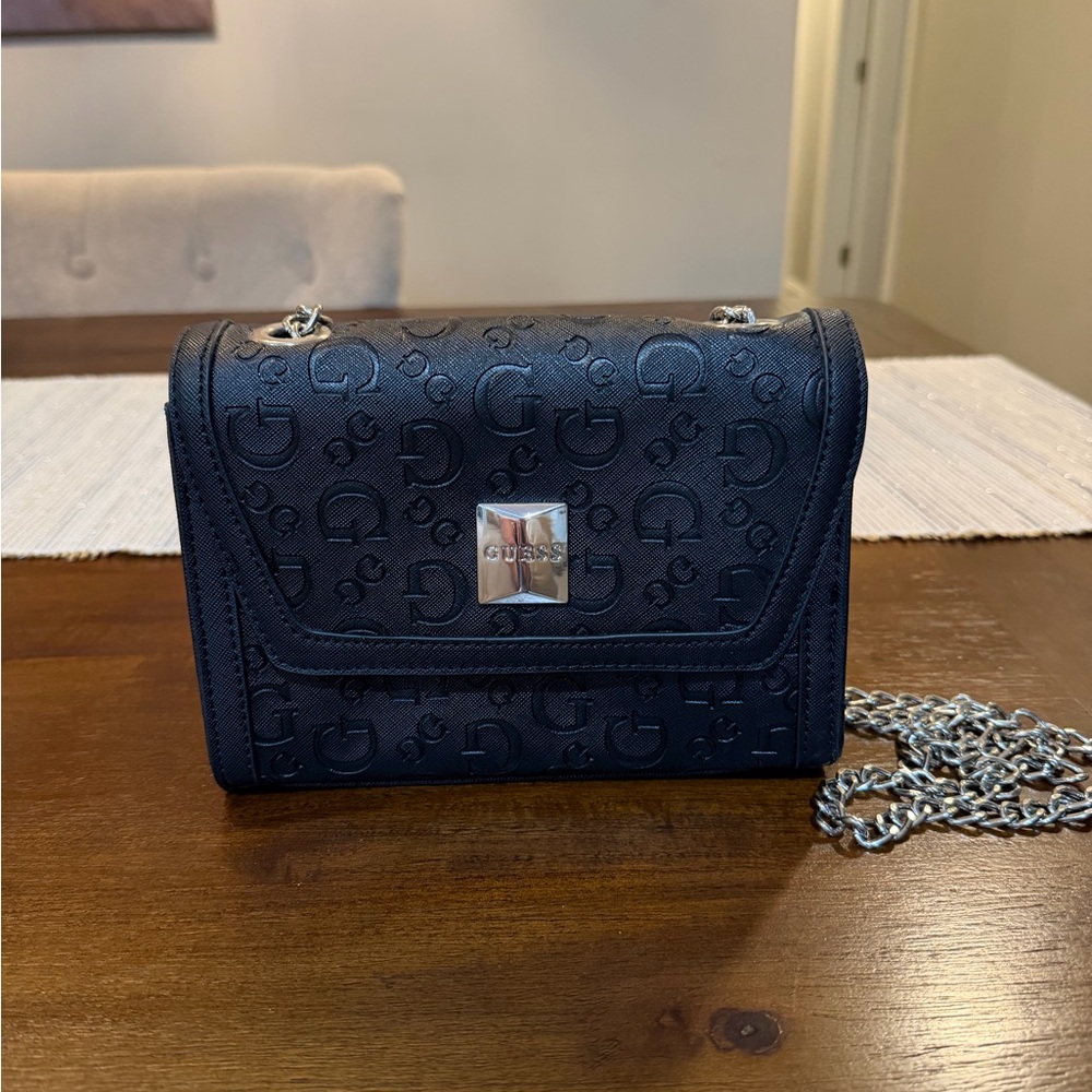 GUESS monogram crossbody / shoulder bag in black with a chain strap.